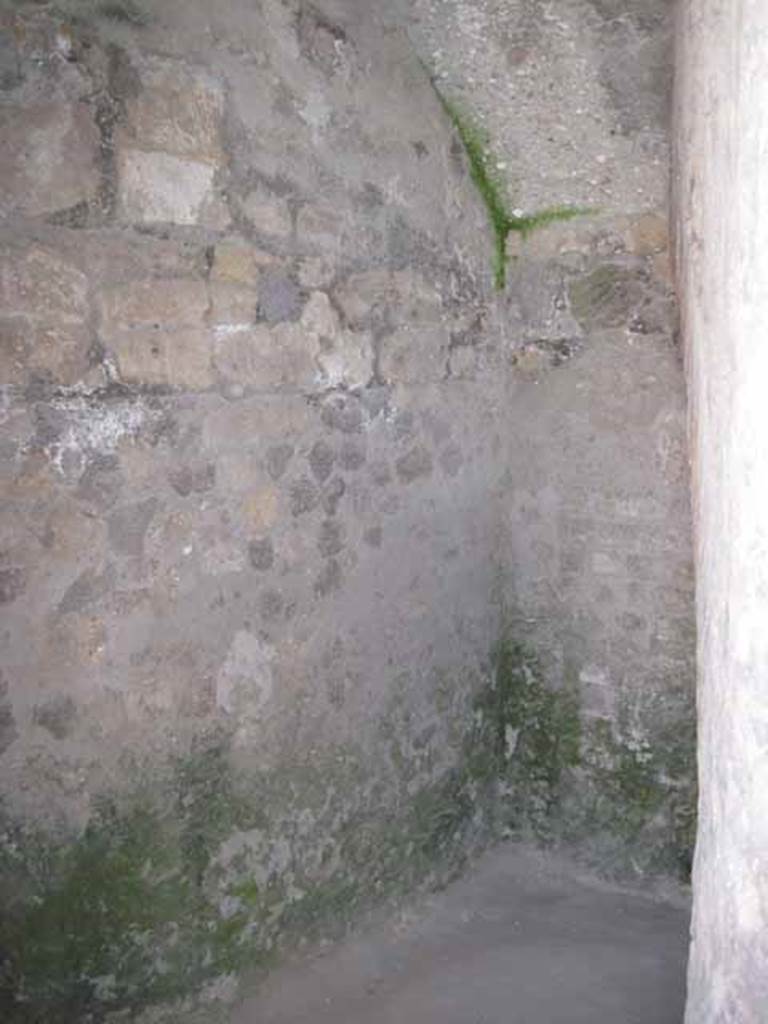 VIII.7.21 Pompeii. September 2010.  At the entrance to the latrine in the archway of the theatre, the entrance switches back right of image under stairs to summa cavea. Photo courtesy of Drew Baker.