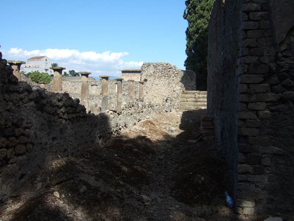 VIII.7.21 Pompeii. September 2005. Looking north-east along the side of the perfumed water tank at the rear of the Large Theatre.