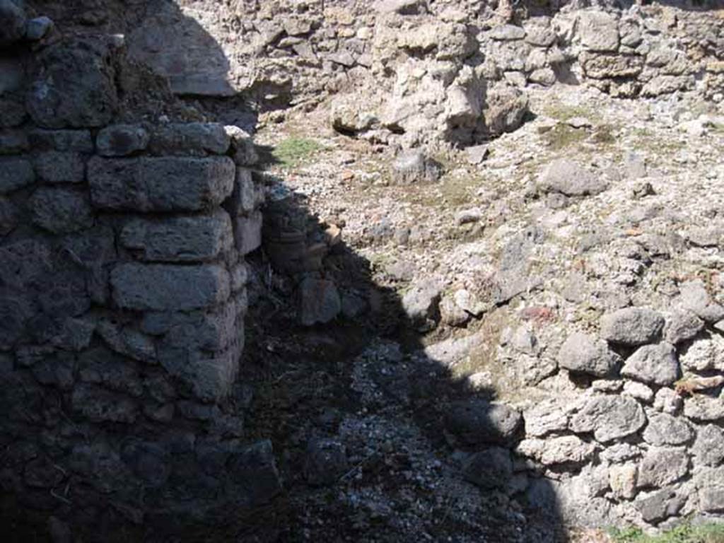VIII.7.22 Pompeii. September 2010. Doorway into area, that was originally below the peristyle of VIII.7.24. Note column fragment presumably from collapse above. Photo courtesy of Drew Baker.