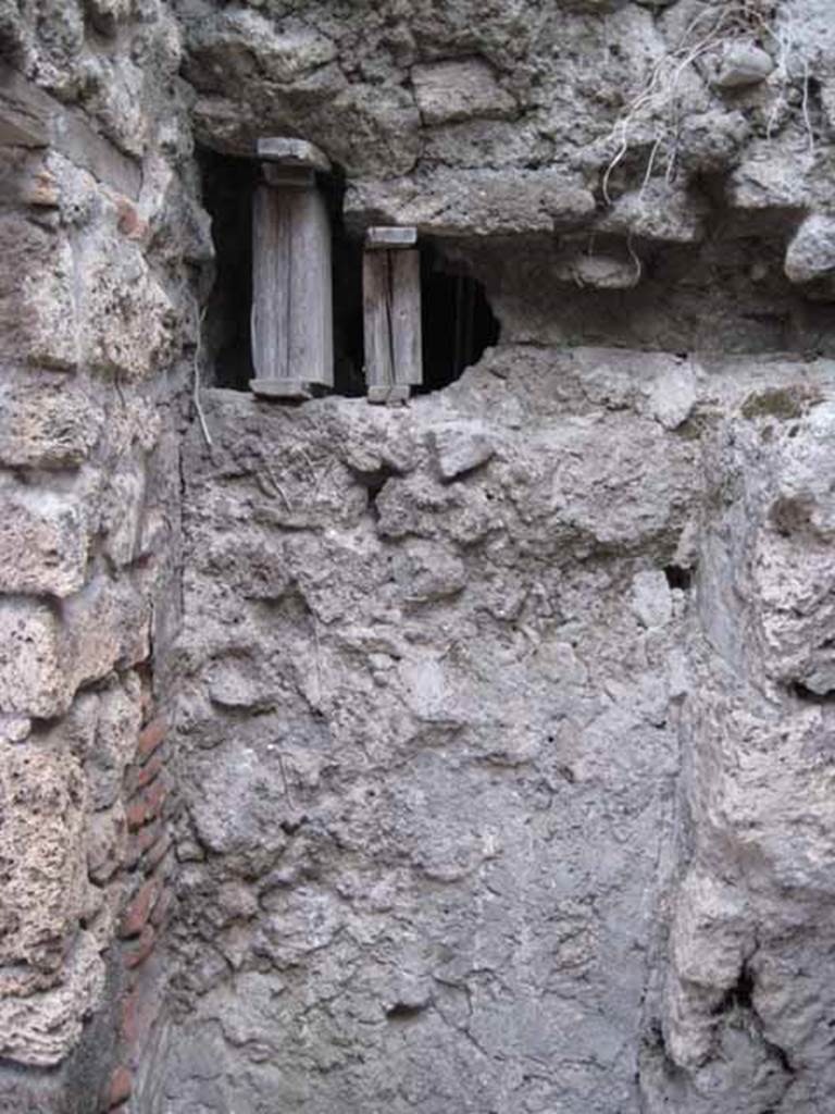 VIII.7.23 Pompeii. October 2010. West wall of small room or latrine with a blocked door (pictured). This used to lead into the VIII.7.24 storeroom.
Photo and information courtesy of Drew Baker/Gareth Beale/Hembo Pagi