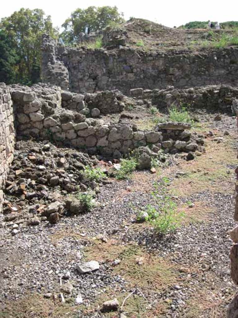VIII.7.23 Pompeii. September 2010. South-east corner of shop. Looking south across area of shop, towards kitchen area. Photo courtesy of Drew Baker.