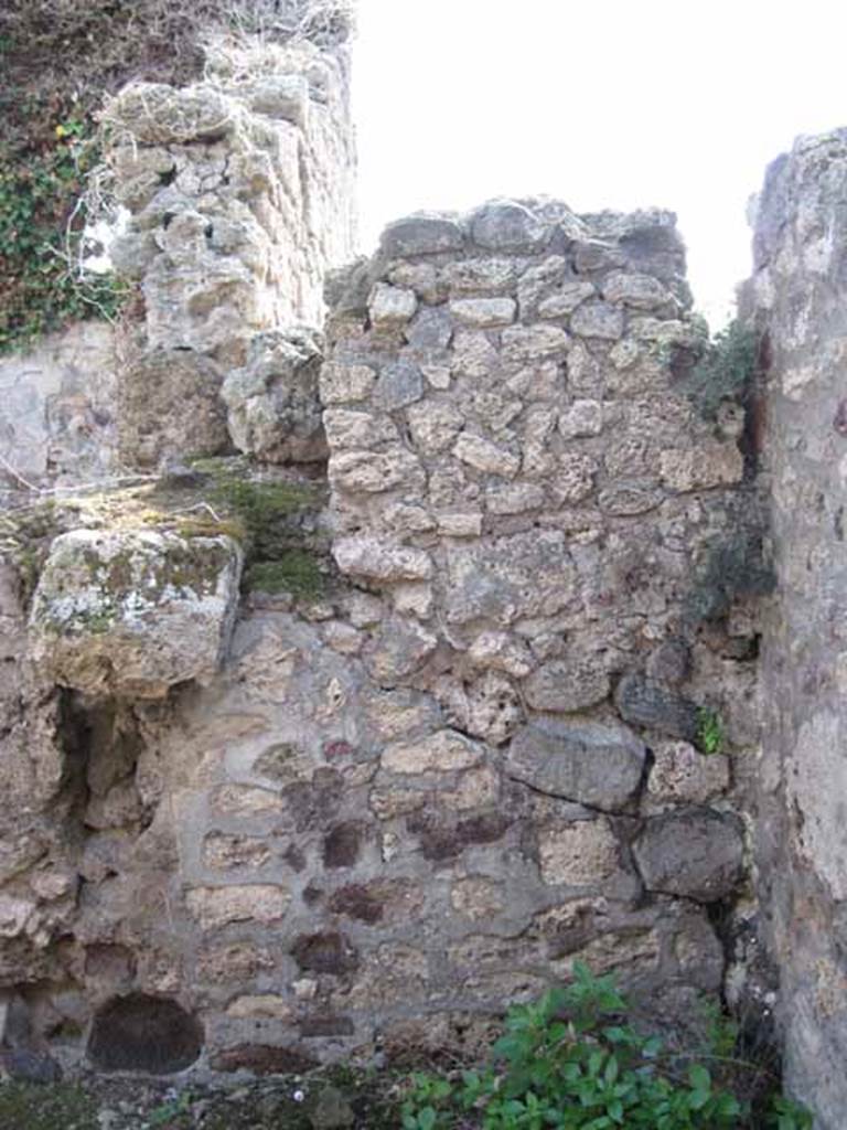 VIII.7.24 Pompeii. September 2010. South wall of oecus. Detail of blocked door or wall at upper level in VIII.7.26. Photo courtesy of Drew Baker.