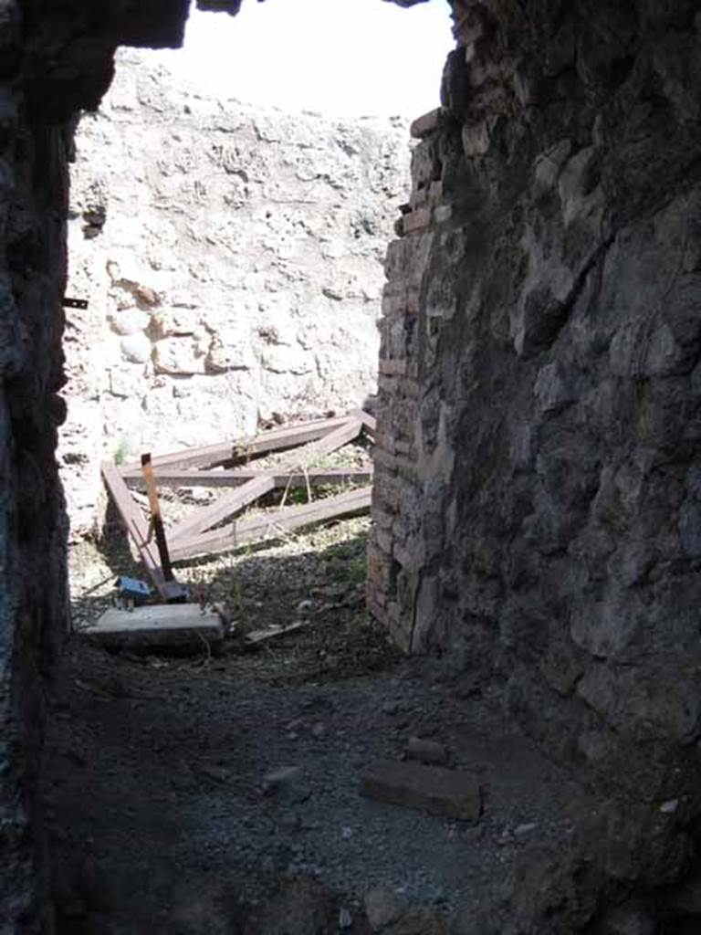 VIII.7.24 Pompeii. September 2010. Looking immediately east from entrance of “storage” room, towards small room in south-east corner of atrium. Photo courtesy of Drew Baker.