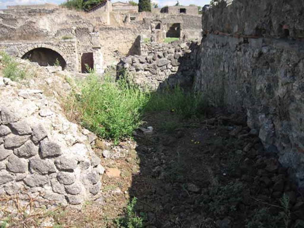 VIII.7.24 Pompeii. September 2010. Looking east from room on south side, towards the extreme eastern wall in the south-east corner. Photo courtesy of Drew Baker.