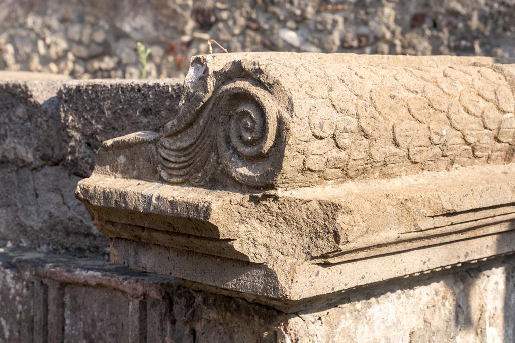 VIII.7.25 Pompeii. October 2023. Detail from north side of altar at west end. Photo courtesy of Johannes Eber.