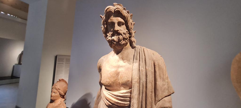 VIII.7.25 Pompeii. April 2023. Upper body of terracotta statue of Aesculapius or Asclepius. Photo courtesy of Giuseppe Ciaramella.