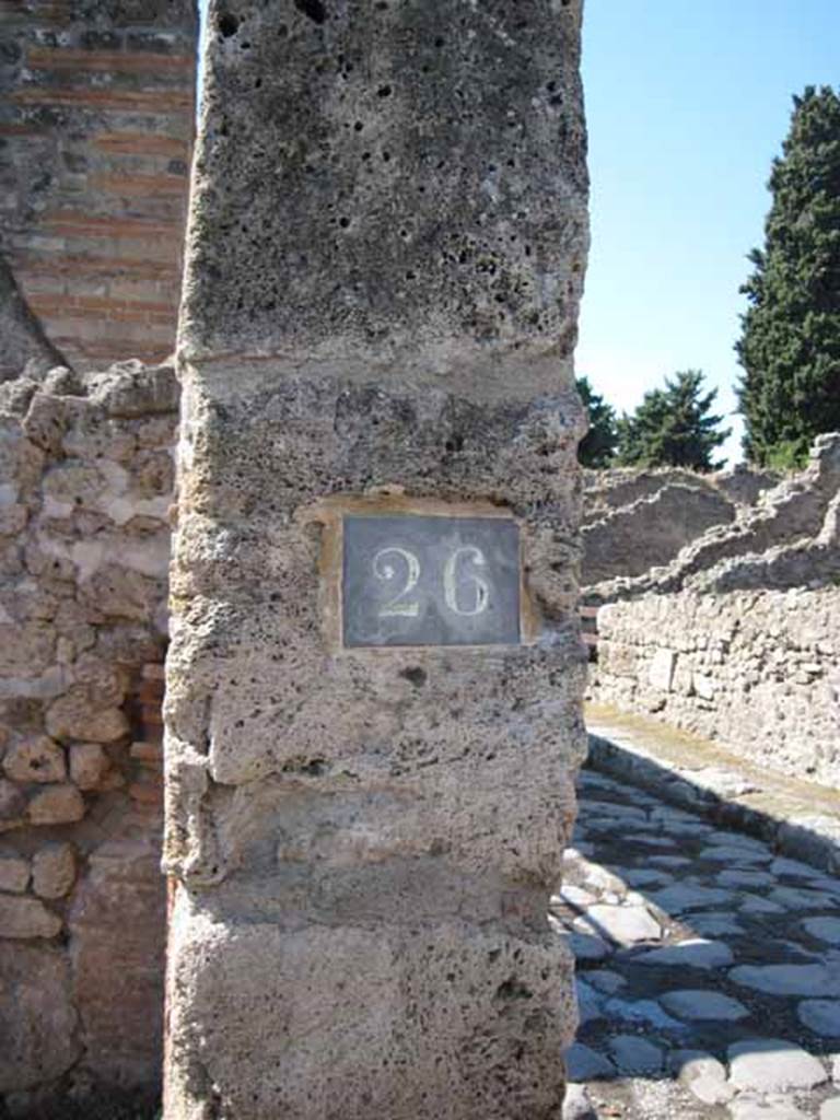 VIII.7.26 Pompeii. September 2010. ID Plate on west wall of entrance doorway. Photo courtesy of Drew Baker.