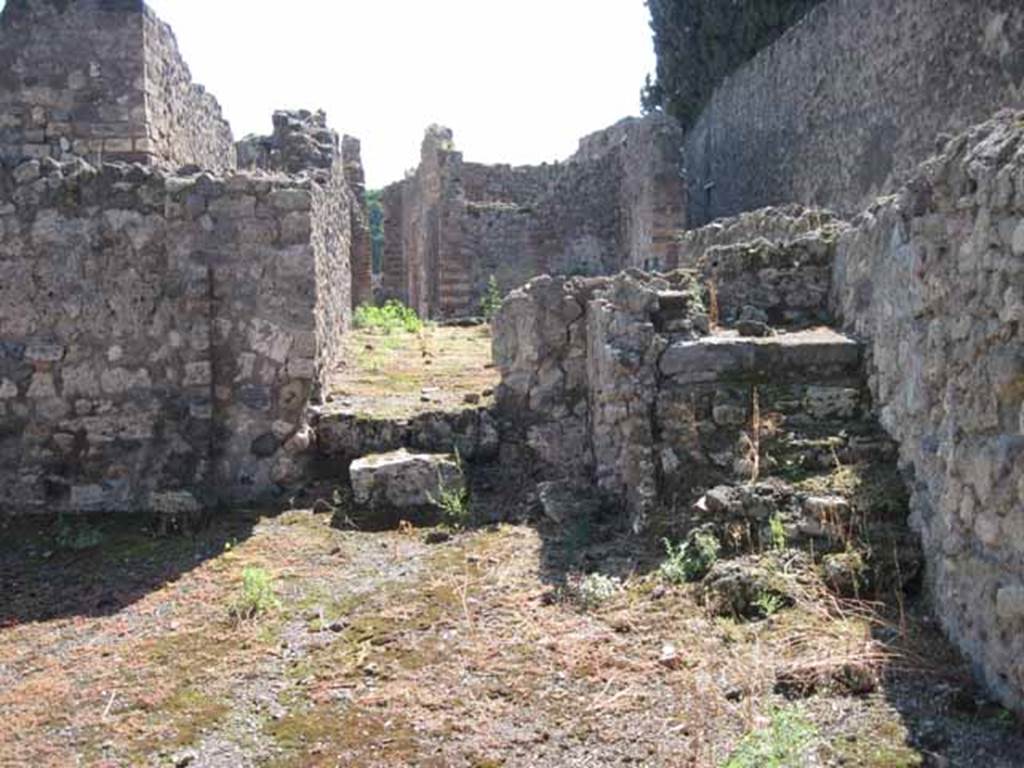 VIII.7.26 Pompeii. September 2010. West side of south wall of main entrance room with doorway to rear. Photo courtesy of Drew Baker.
