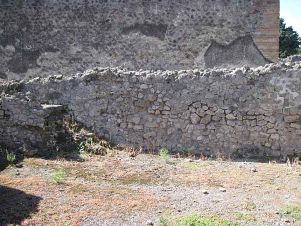 VIII.7.26 Pompeii. September 2010. West wall of main entrance room, with steps to upper floor. Looking towards Temple of Isis. Photo courtesy of Drew Baker.