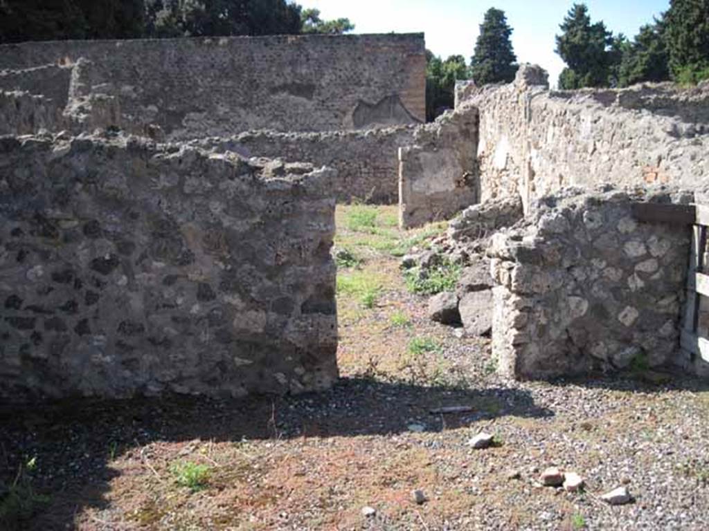 VIII.7.26 Pompeii. September 2010. West wall with doorway to another two rooms and then followed by the entrance room with doorway of VIII.7.26.
Photo courtesy of Drew Baker.