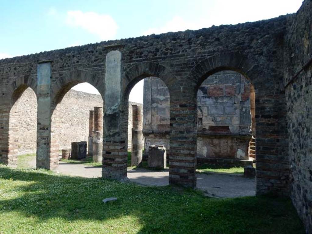 VIII.7.28, Pompeii. May 2015. Looking out through the arches of the Ekklesiasterion on to the west portico. 
Photo courtesy of Buzz Ferebee.