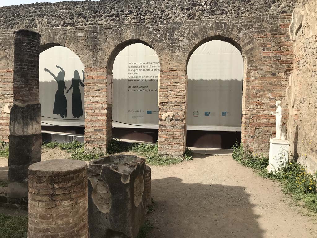 VIII.7.28, Pompeii. April 2019. North portico looking towards the arches of the Ekklesiasterion in the west portico.
A reproduction statue of Isis is now in place.
Photo courtesy of Rick Bauer.
