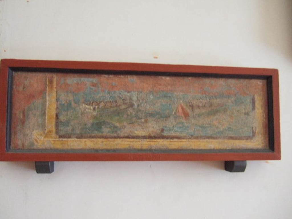 VIII.7.28 Pompeii. From east part of north portico. Naval scene. 
It was part of an architectural panel, which was left in situ, probably due to its poor condition. 
Now in Naples Archaeological Museum. Inventory number 8590.