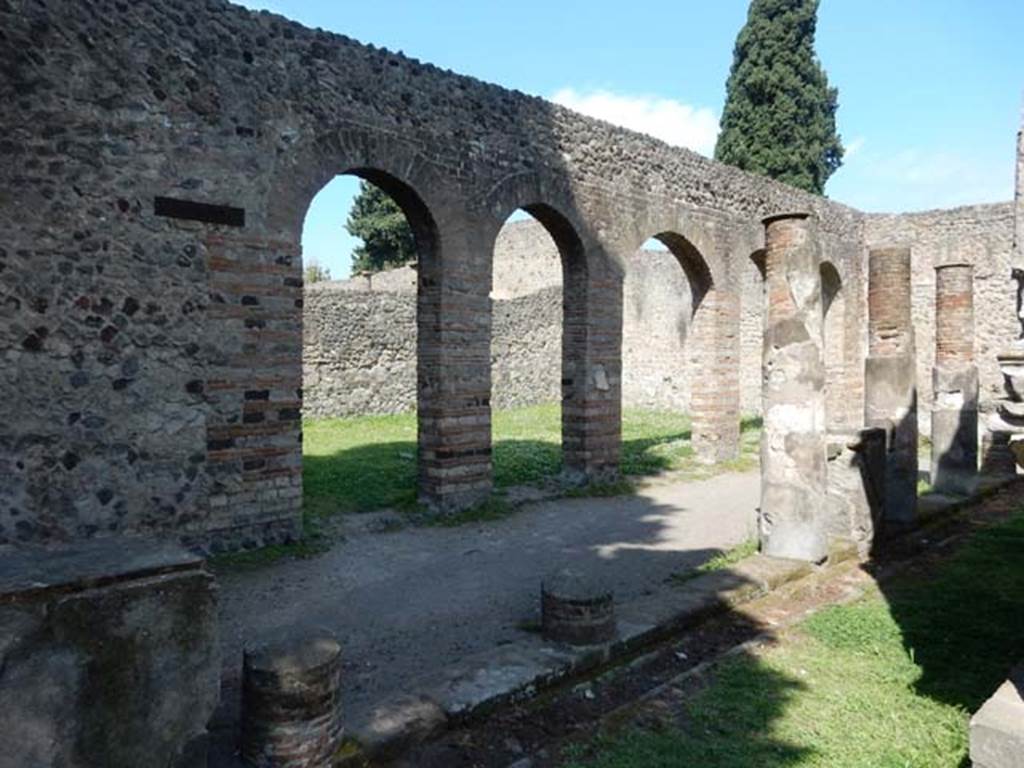 VIII.7.28, Pompeii. May 2015. Looking towards west wall of portico and the arches of the Ekklesiasterion, from south-west corner. 
Photo courtesy of Buzz Ferebee.