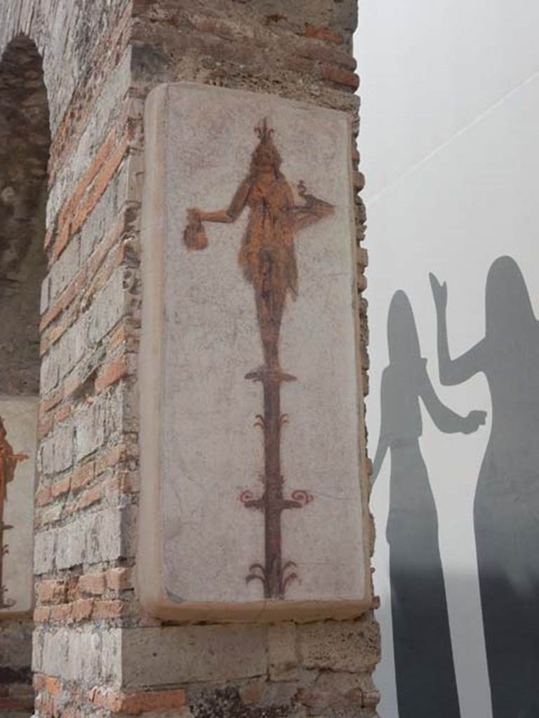 VIII.7.28 Pompeii. May 2017. Reproduction fresco on south wall of second arch from north in the Ekklesiasterion.
Priestess on a candelabrum with jar and peacock. 
Now in Naples Archaeological Museum. Inventory number 8915.
Photo courtesy of Buzz Ferebee.