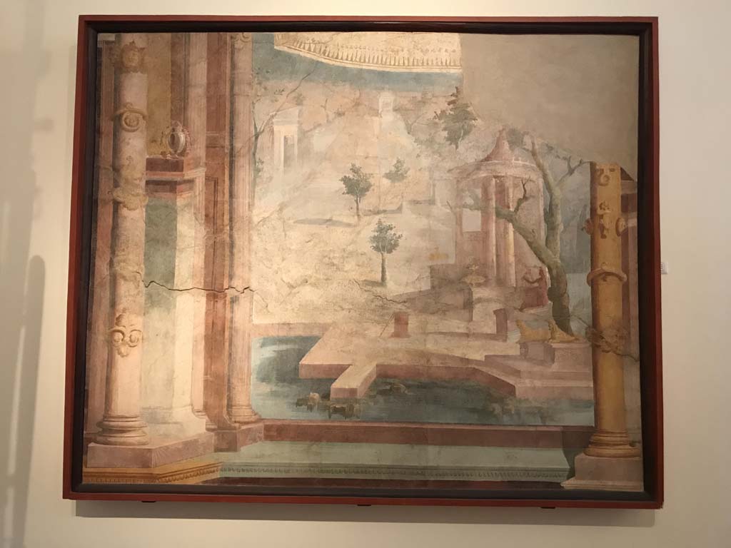 VIII.7.28 Pompeii. April 2019. Painting showing sacred fence with temple, statues, and square with trees, seen through an architectural scene.
Found on the left area of the west wall of the Ekklesiasterion. Photo courtesy of Rick Bauer.