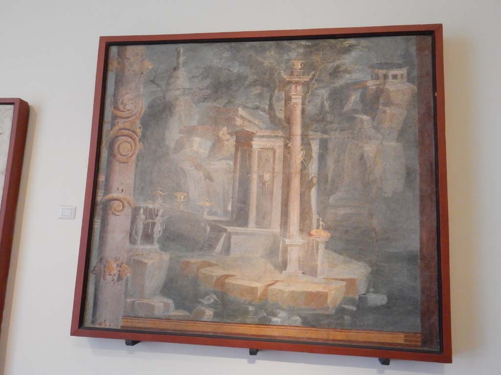 VIII.7.28 Pompeii. June 2019. Rocky landscape with little temple, sacred door and king-fisher.
Found on the right side of the north wall.  Photo courtesy of Buzz Ferebee.
