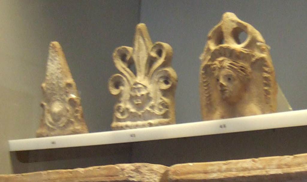 VIII.7.28 Pompeii. Three antefixes from temple.
