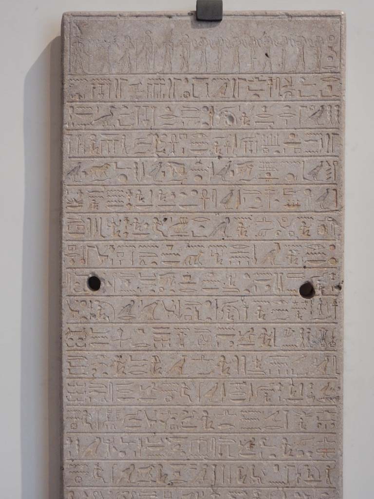 VIII.7.28 Pompeii. June 2019. Upper 15 of the lines of hieroglyphs from the Limestone stele. 
Photo courtesy of Buzz Ferebee.