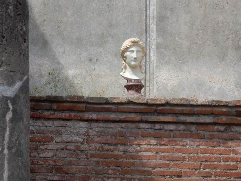 VIII.7.28 Pompeii. May 2017. Reproduction marble bust of Isis at the rear of the temple cella. 
This marble head of Isis is a reproduction of the one found in the entrance to the Ekklesiasterion.
Now in Naples Archaeological Museum. Inventory number 6290.
Photo courtesy of Buzz Ferebee.