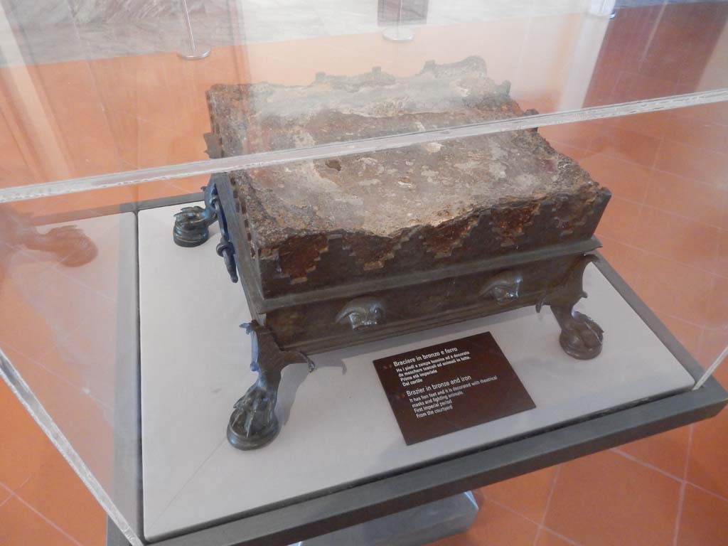 VIII.7.28 Pompeii. Found in the court of the temple. 
Brazier made of bronze and iron with lion’s paw feet and decorated with theatrical masks and animals fighting. 
Now in Naples Archaeological Museum. Inventory number 135. Photo courtesy of Buzz Ferebee.