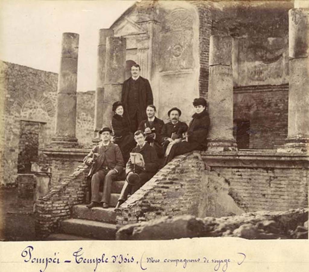 VIII.7.28 Pompeii. Old undated photograph, possibly c.1875 to early 1880s. Photo courtesy of Rick Bauer.
The man in front is holding a book, a copy of the Scafati Guide to Pompeii.  
Looking at the higher resolution original photo, the cover of the booklet has an image of the first cast that Fiorelli made in 1863.
It also has a curved top line of type above the word Pompei and has no binding on the spine.
These would date the booklet to the original editions which first came out in 1875.  
Based on a comparison with copies of the Scafati guide which Rick has in his private collection, the cover in the photo matches the first edition of the guide book.  
As such, he estimates the photo was taken sometime from 1875 to early 1880s.