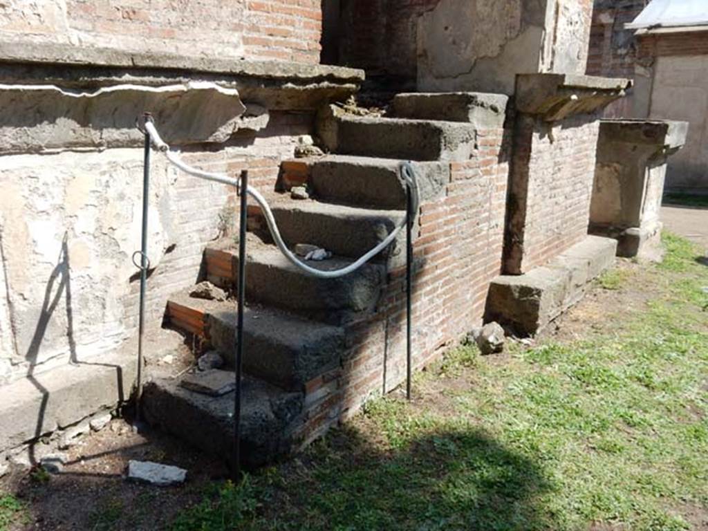 VIII.7.28, Pompeii. May 2015. Narrow steps on south side leading to a side doorway opening into the cella. Photo courtesy of Buzz Ferebee.