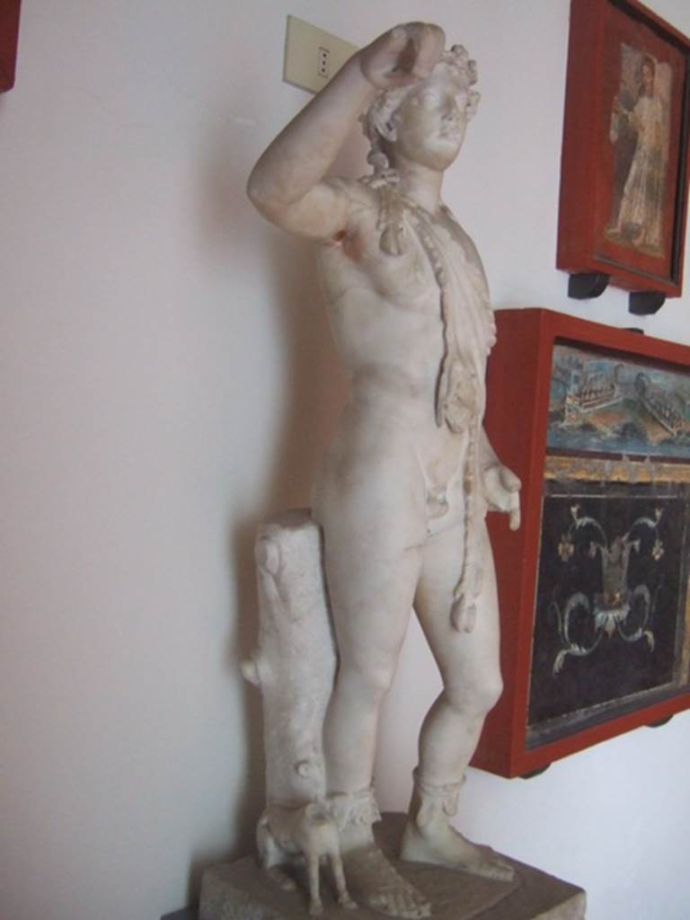 VIII.7.28 Pompeii.  Statue of Dionysus pouring wine into the mouth of the panther next to his feet.  Now in Naples Archaeological Museum.