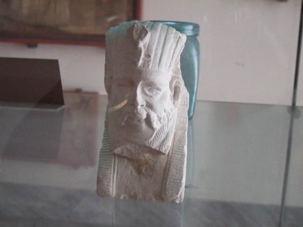 VIII.7.28 Pompeii. Limestone Egyptian style herm found in the temple enclosure. It shows a bearded Dionysus, in the archaic iconographic tradition, covered with hieroglyphic motifs and with Pharaonic headgear.
Now in Naples Archaeological Museum. Inventory number 6516.