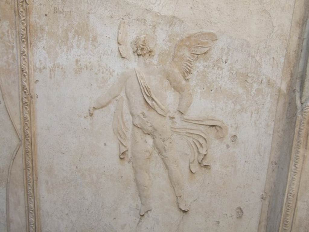 VIII.7.28 Pompeii. December 2007. Purgatorium, detail of stucco floating cupid from east side. See Mau, A., 1907, translated by Kelsey, F. W., Pompeii: Its Life and Art. New York: Macmillan. (p. 180).
