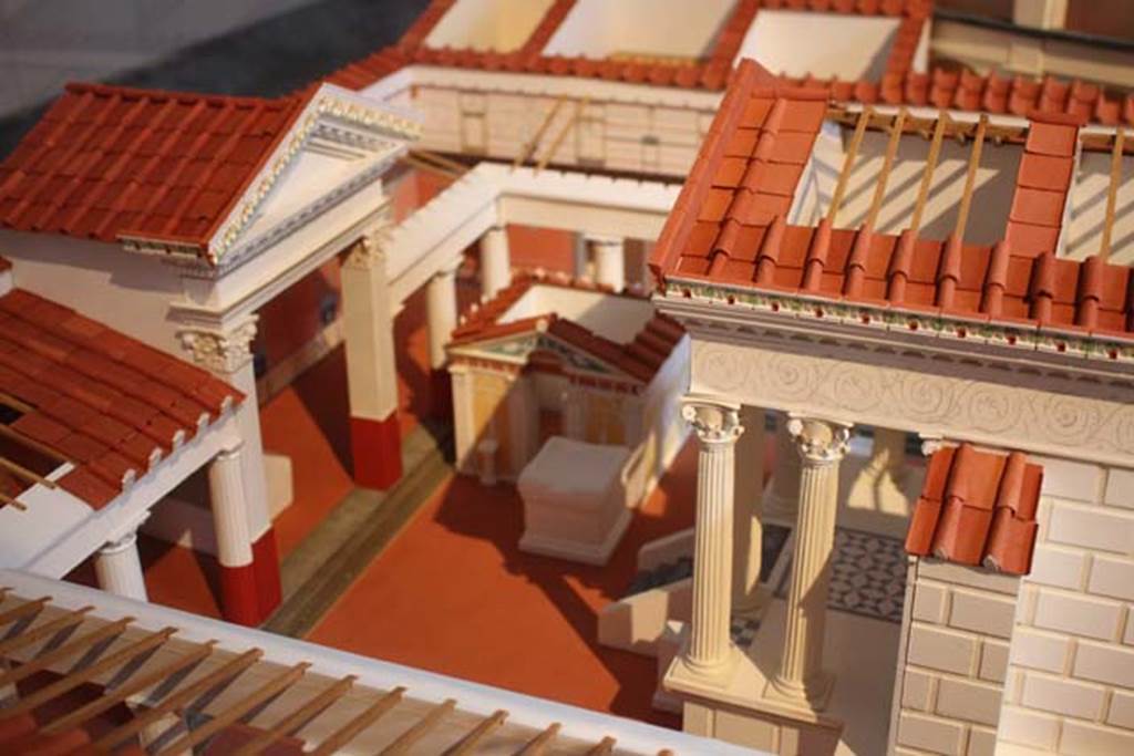 VIII.7.28 Pompeii. Model of temple now in Naples Museum. Looking south along east side of portico towards purgatorium. 
Photo courtesy of Giampiero Bevagna.