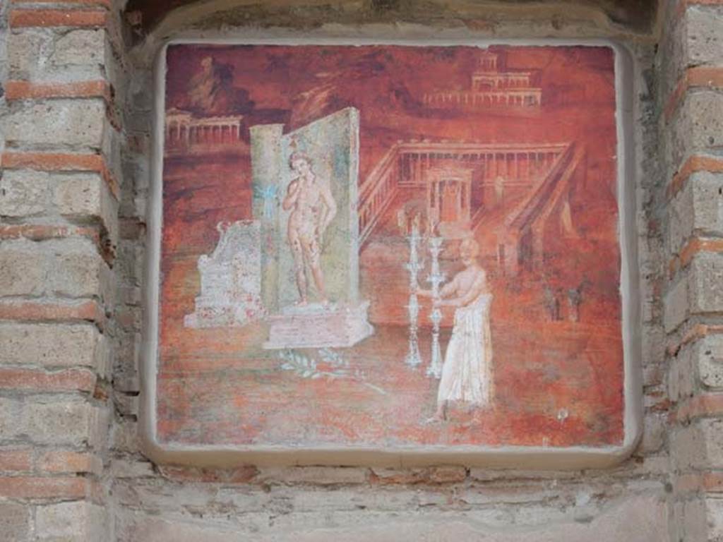 VIII.7.28 Pompeii. May 2017. East portico niche with reproduction of the fresco with a montage of features concerned with the worship of Isis. Now in Naples Archaeological Museum. Inventory number 8975. Photo courtesy of Buzz Ferebee.
