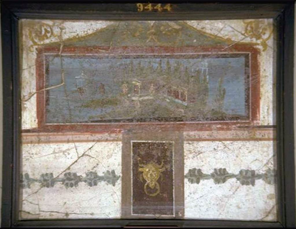 VIII.7.28 Pompeii. South part of east wall of portico. 
Landscape, surmounted by a pediment and with a small panel underneath with a bovine head. 
Now in Naples Archaeological Museum. Inventory number 9444.