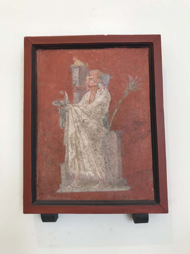 VIII.7.28 Pompeii. April 2019. Found on right feature of east portico. 
Painting of a priest wearing a white robe from shoulder to ankles. 
A cobra is on a rose crown held out in his hands.
Now in Naples Archaeological Museum. Inventory number 8922.
Photo courtesy of Rick Bauer.