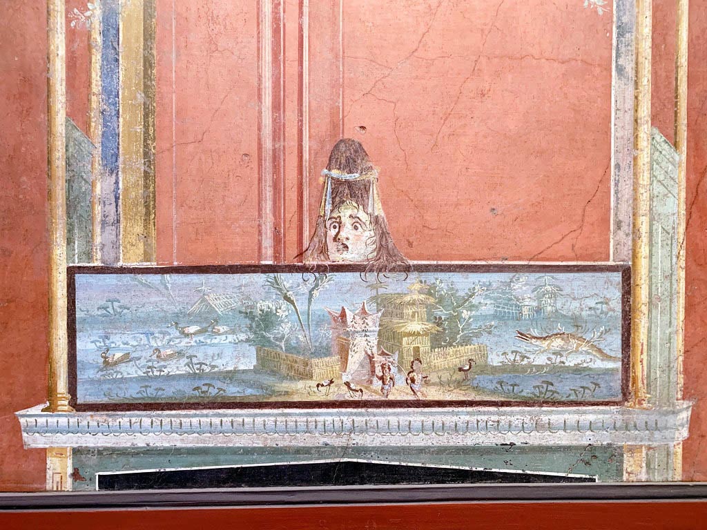 VIII.7.28 Pompeii. December 2019. 
From the left of the east wall of the portico. Detail of Nilotic scene with two pigmies and surmounted by a female theatrical mask. 
Now in Naples Archaeological Museum. Inventory number 8607.
Photo courtesy of Giuseppe Ciaramella.