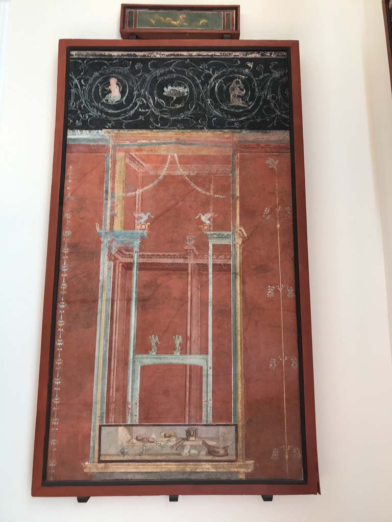 VIII.7.28 Pompeii. April 2019.  From north part of the east portico. 
Architectural scene with still life and frieze of scrolls.
A similar panel (8536) was found on the opposite western wall.
Now in Naples Archaeological Museum. Inventory number 8537.
Photo courtesy of Rick Bauer.