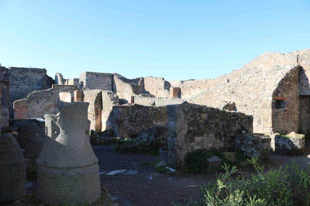 IX.1.3/33 Pompeii. December 2018. Looking north-west across rear rooms in bakery. Photo courtesy of Aude Durand.