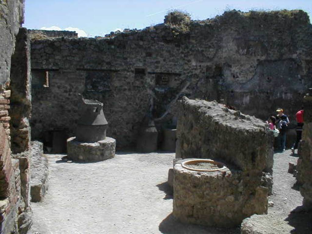 IX.1.3/ IX.1.33 Pompeii. May 2005. Looking south across bakery from near oven.
