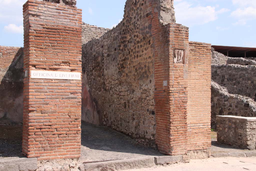 IX.1.5 Pompeii. September 2021. 
Looking towards south wall of entrance corridor, and tufa plaque in south pilaster. Photo courtesy of Klaus Heese.
