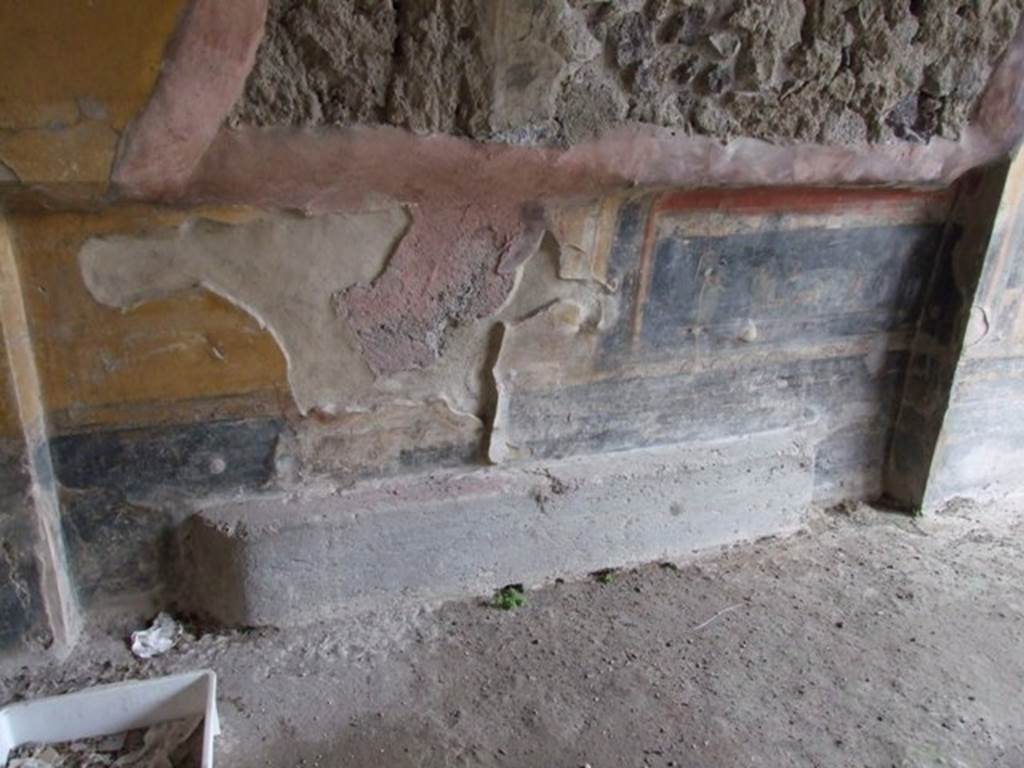 IX.1.7 Pompeii. December 2007. North wall in north-west corner of triclinium, with recess. 
The black zoccolo was divided into panels, above it, the predella which was divided by a pilaster, contained two paintings but only one now remains. According to Sogliano, the painting showed a Psyche in a cart pulled by two goats and being led by a cupid, whilst another Psyche, wearing a green robe, followed it.
See Sogliano, A., 1879. Le pitture murali campane scoverte negli anni 1867-79. Napoli: Giannini. (p.68, no.399).