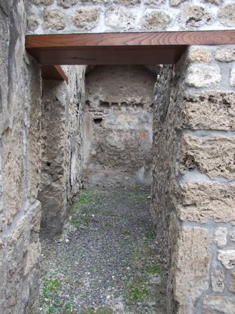 IX.1.12  Pompeii. December 2007.  Corridor on north-west side of peristyle next to stone steps.