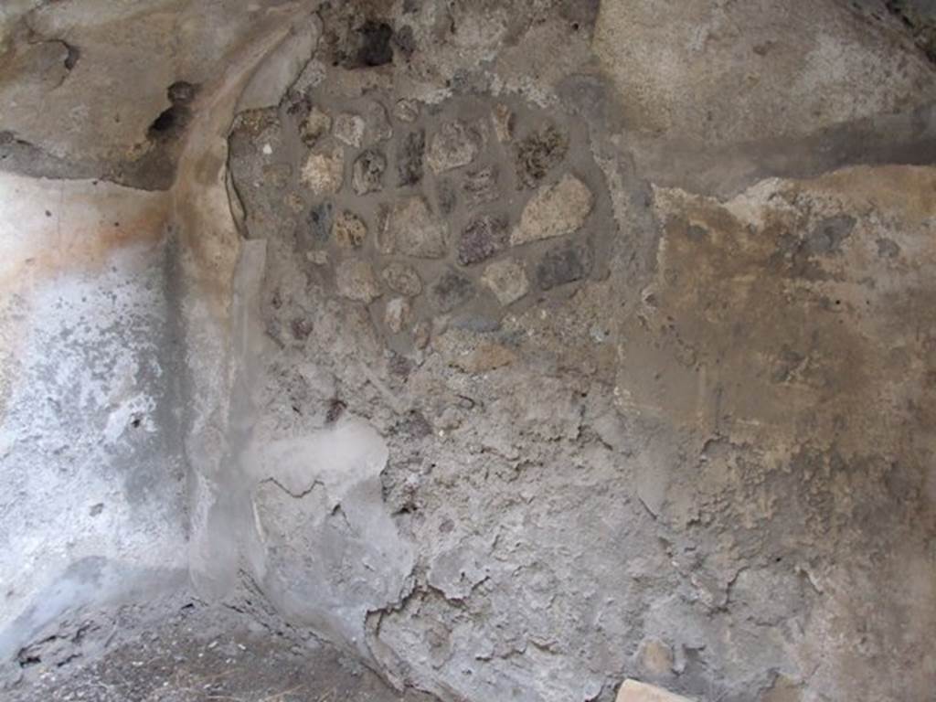 IX.1.12  Pompeii. December 2007.  East wall and arch under the stairs in room at end of corridor on north-west side of peristyle.