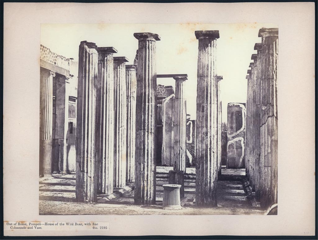 IX.1.20 Pompeii. 1869-1877. Looking south across atrium from tablinum 10.
This shows the puteal for the cistern, the pillar for a fountain, and a circular fountain disc central in the impluvium.  
Photo courtesy of British School at Rome, John Henry Parker Collection, inv. no 2195.
https://digitalcollections.bsr.ac.uk/islandora/object/PARKER:735