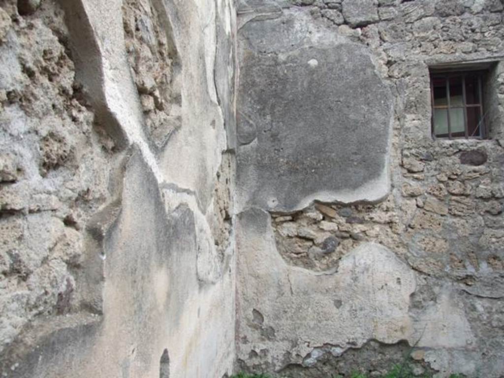 IX.1.22 Pompeii. December 2007. Room 4, north-east corner of triclinium. According to Bragantini, the walls of this room would have had a low white dado. The middle zone was white with yellow architectural painting and red stripes. The upper zone was also white.
See Bragantini, de Vos, Badoni, 1986. Pitture e Pavimenti di Pompei, Parte 3. Rome: ICCD. (p.400, triclinio ‘e’)