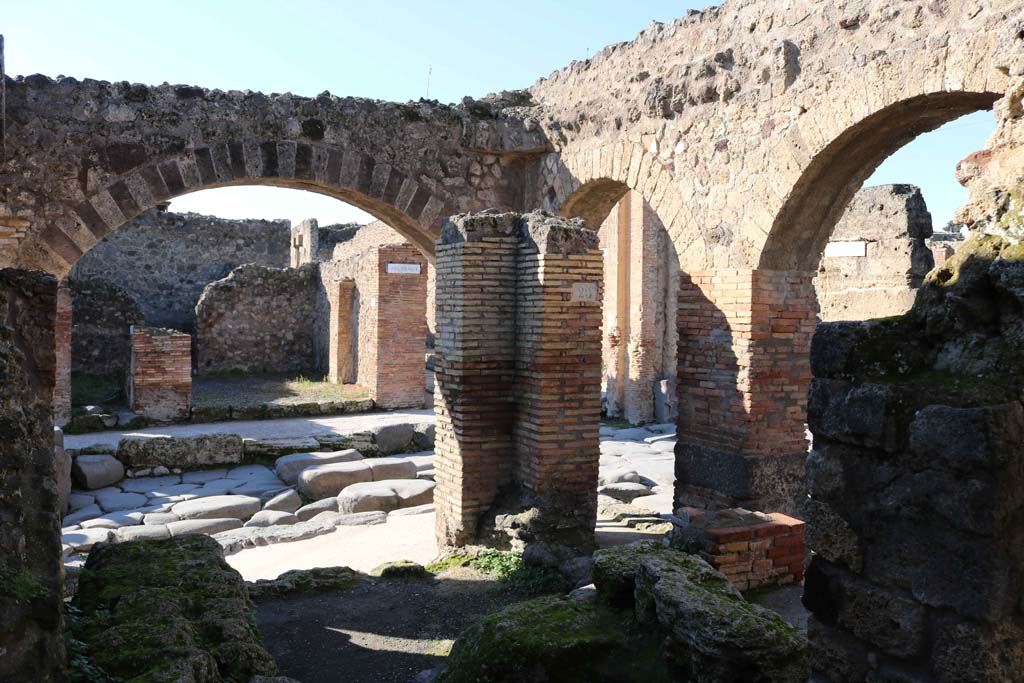 IX.2.1 Pompeii. December 2018. 
Looking north-west from interior towards Via Stabiana, on left, junction with unnamed vicolo (Via degli Augustali), on right.
Photo courtesy of Aude Durand.
