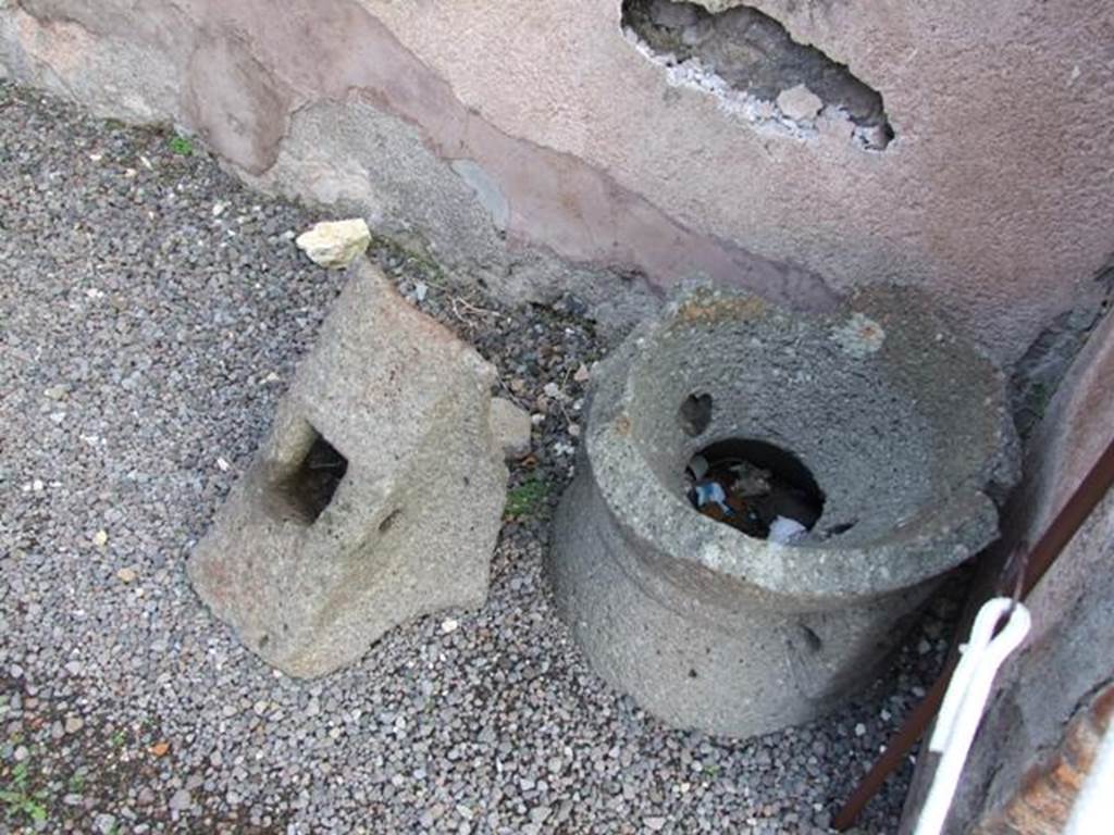 IX.2.4 Pompeii. December 2007. Fragments of mills near entrance to shop, in south-west corner.