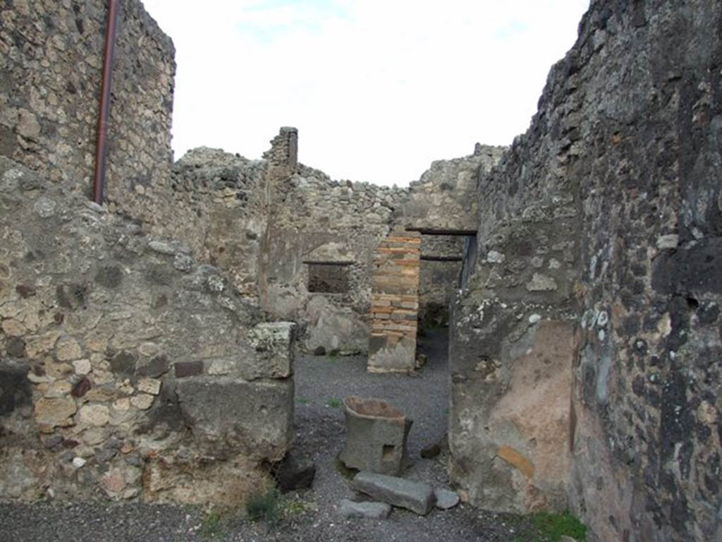 IX.2.4 Pompeii. December 2007.  East wall of shop, and doorway to atrium, with more fragments of mills.
