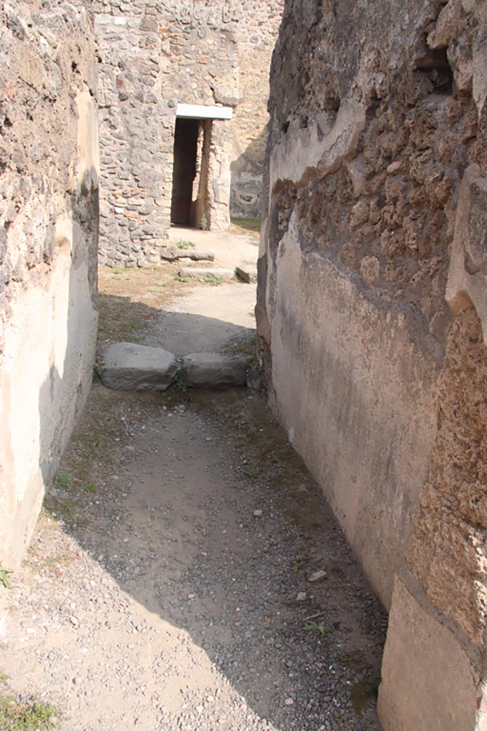 IX.2.7 Pompeii. October 2023. 
Looking east along corridor (d) towards rear rooms. Photo courtesy of Klaus Heese.