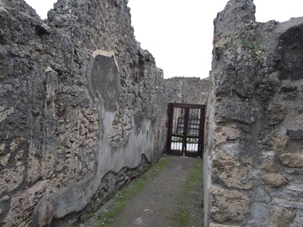 IX.2.10 Pompeii. December 2007. Entrance corridor looking west to entrance. On the right would be the doorway to a triclinium, not photographed. According to Sogliano, the paintings found in this room, the triclinium on west side of peristyle, would be -  
Psyche with plate in left hand. (no. 388 but nearly vanished). Psyche with cornucopia or similar, (no.389.), p.67.
Female figure, on a yellow background, with dark red mantle, in her right hand a plate and her left hand holding up a garland? (no.834), p.160.
See Sogliano, A., 1879. Le pitture murali campane scoverte negli anni 1867-79. Napoli: Giannini. (p.67 and 160)
According to Helbig, Apollo (H216), Endymion (H959), and Narcissus (H1360) were found here. See Helbig, W., 1868. Wandgemälde der vom Vesuv verschütteten Städte Campaniens. Leipzig: Breitkopf und Härtel.