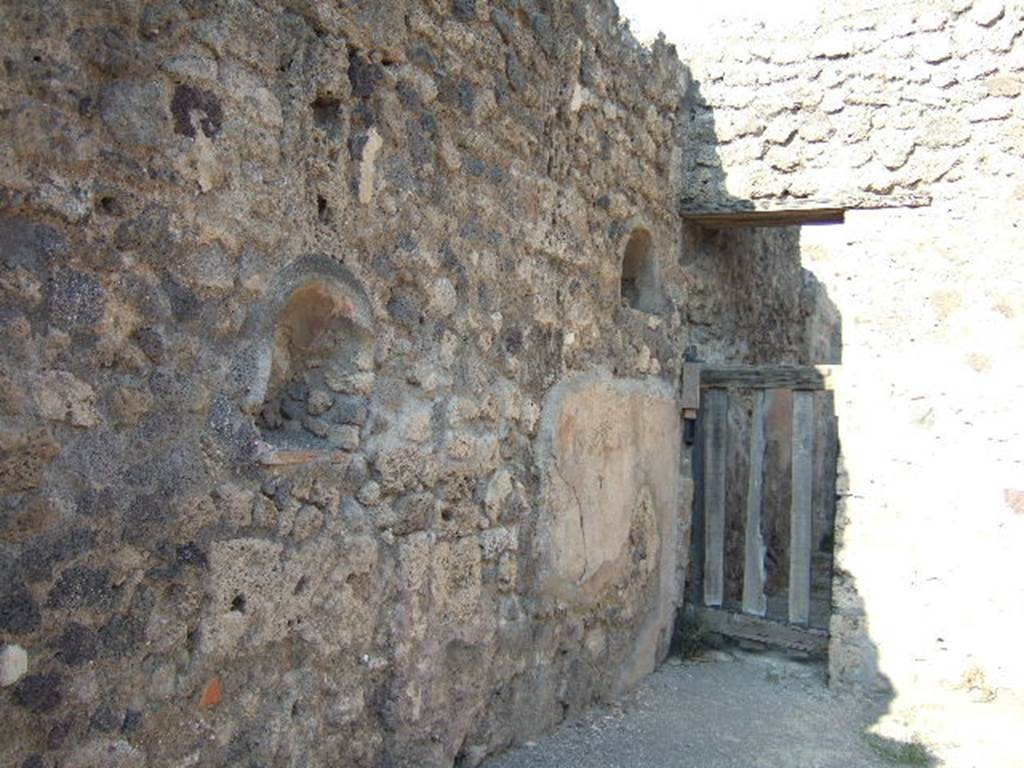 IX.2.11 Pompeii. September 2005. North wall with two niches.